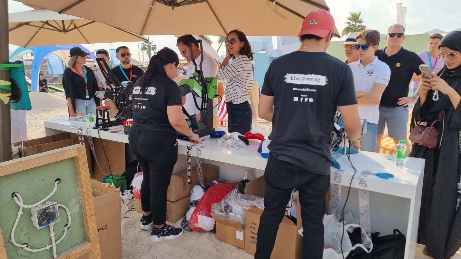 InkMASH crew live-printing branded tees for a crowd at the Icons of Porsche festival